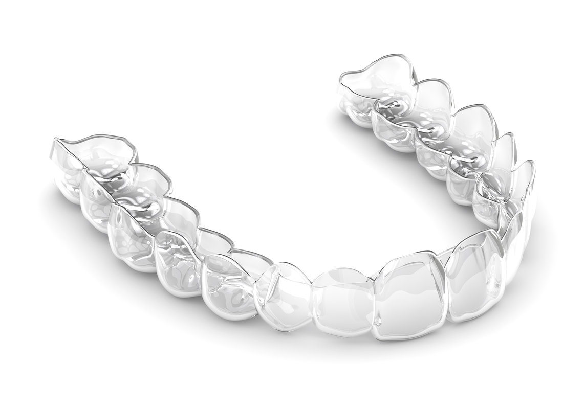 3d render of invisalign removable and invisible vacuum formed retainer over white background.